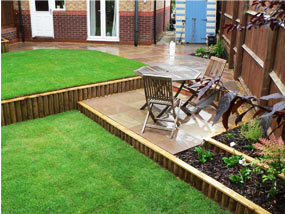 sloping garden design garden completed - edging